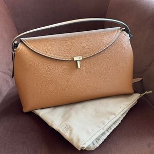 TOTEME T-Lock textured-leather shoulder bag in tan